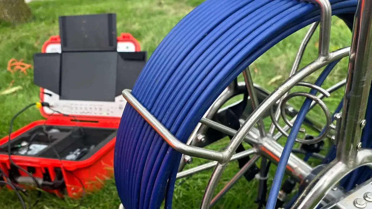 Professional sewer camera reel and inspection monitor set up at a residential property